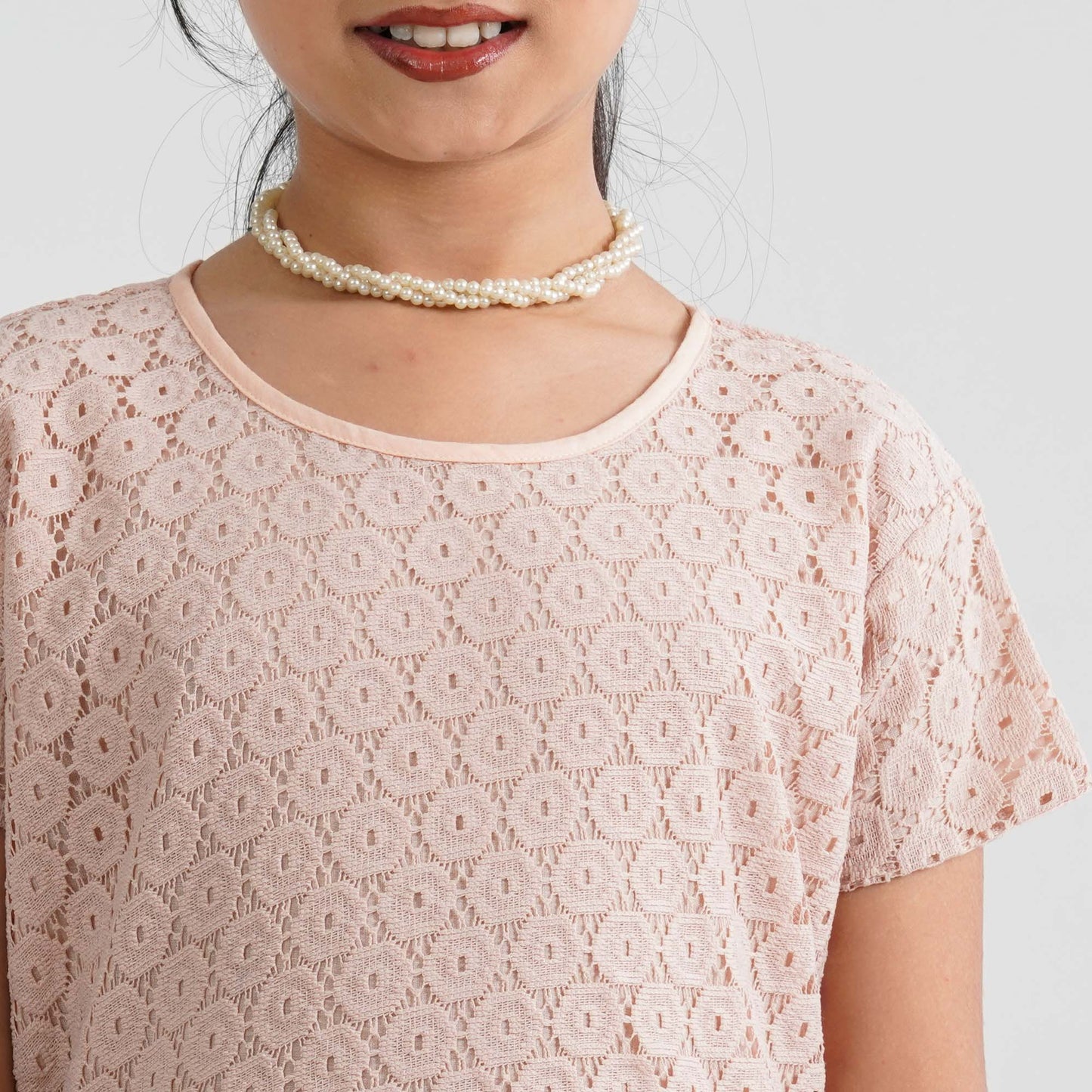 Girl’s Peach Pleated Gown